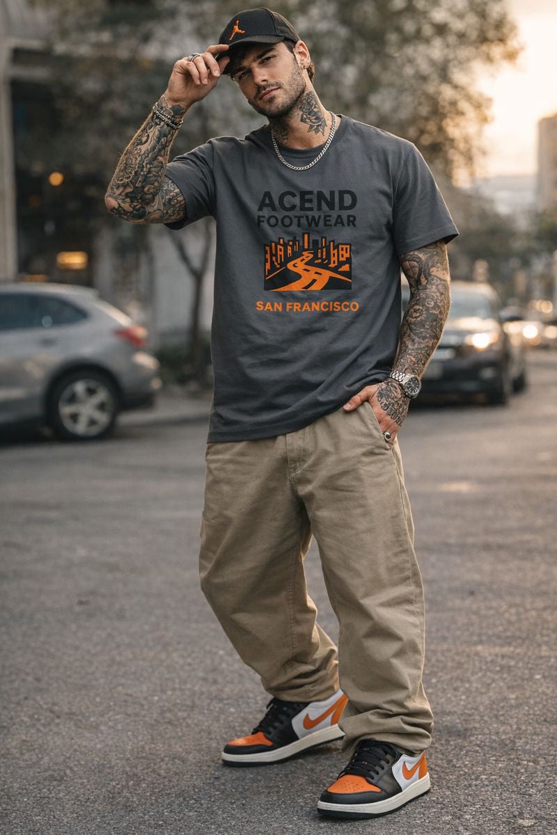 Original archive model wearing charcoal ACEND San Francisco tee, khakis, black and orange cap and Air Jordan 1 Low Black Starfish sneakers